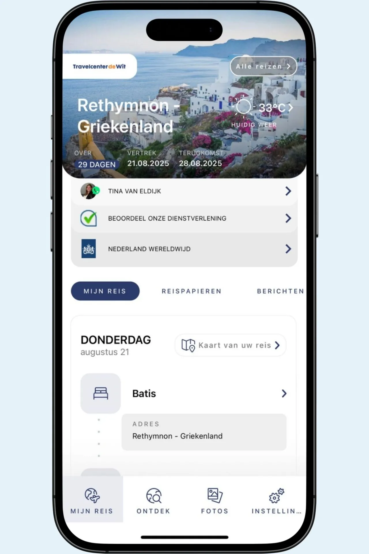 Overzichtsscherm ‘Mijn Reis’ in de Travelcenter app met bestemming, vertrek- en retourdata, huidige temperatuur en vluchtinformatie.